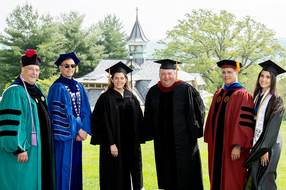 Mount Saint Mary College’s 59th annual Commencement, Saturday, May 21. Left to right: Fr. Gregoire Fluet, college chaplain and director of Campus Ministry; Dr. Jason N. Adsit, president of the Mount; Honorary degree recipient and Commencement speaker Karina Cabrera Bell ’01, a Mount alumna, a Fortune 500 executive, and a former official in the Obama White House; Michael Horodyski, Chair of the Board of Trustees of the college; George Abaunza, Vice President for Academic Affairs; and Victoria Veloz-Vicioso of Englewood, N.J., a Mount Business major and president of the college’s Latino Student Union.